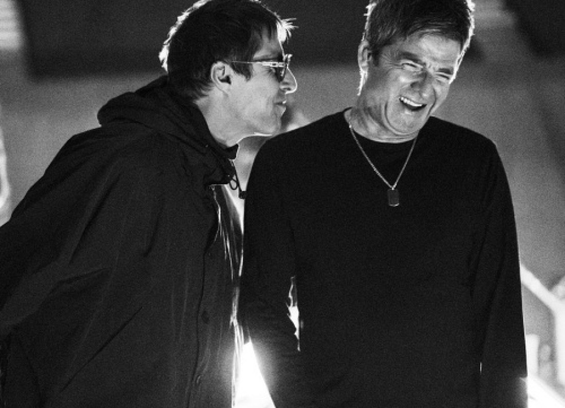 Noel and Liam Gallagher on stage